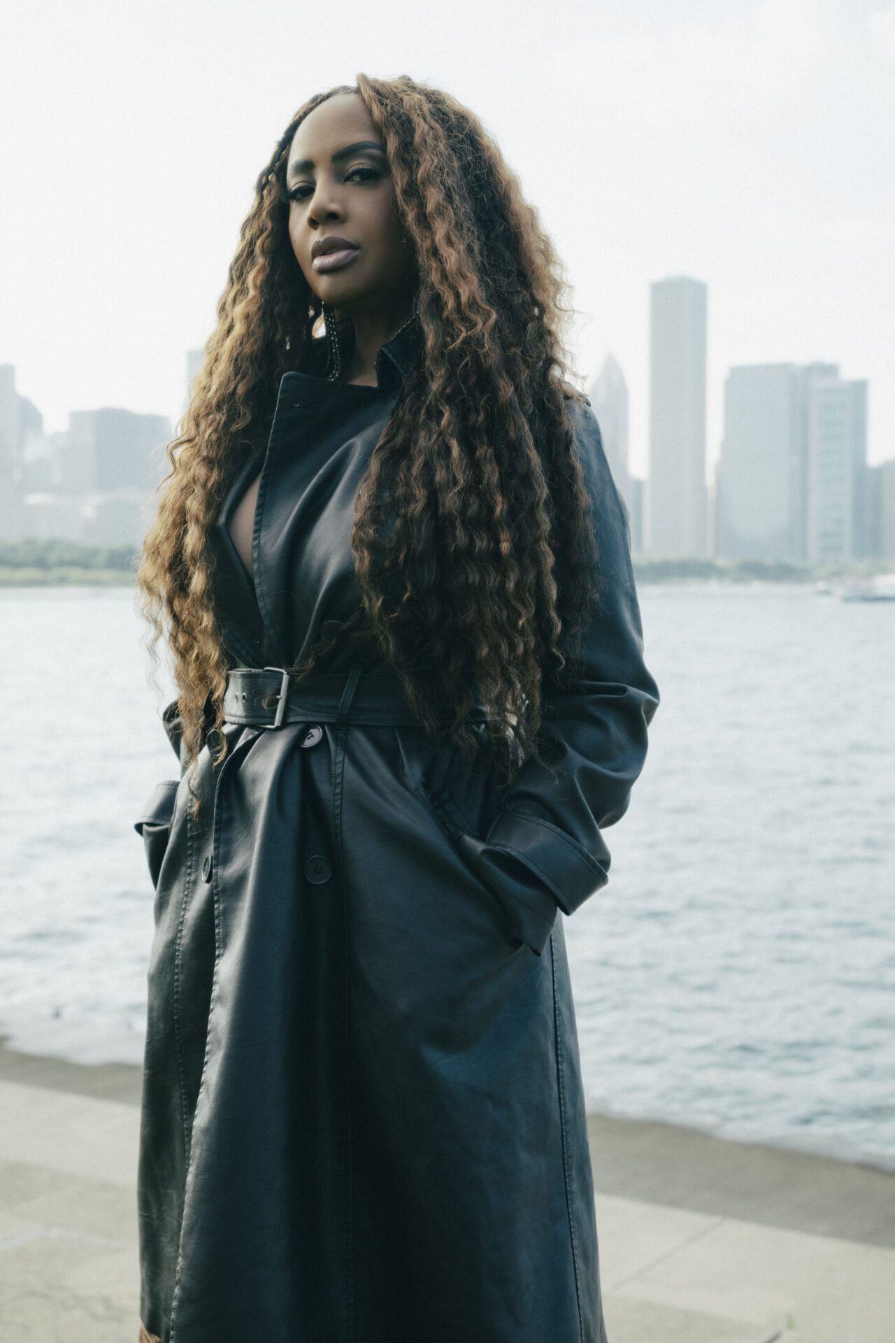 Lalah Hathaway standing beside the Chicago waterfront